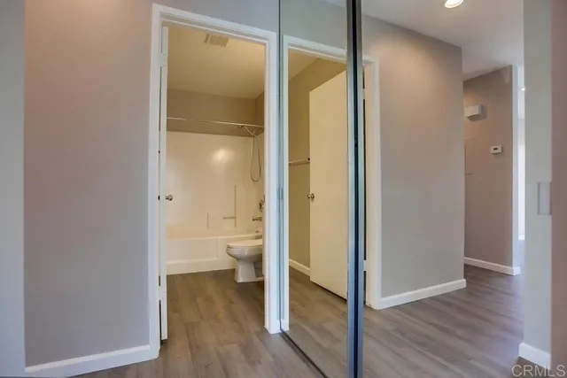 a bathroom with a glass shower door