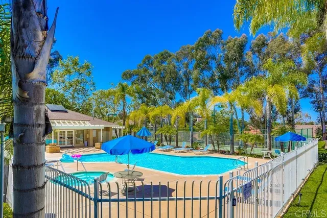 a view of a swimming pool with a patio