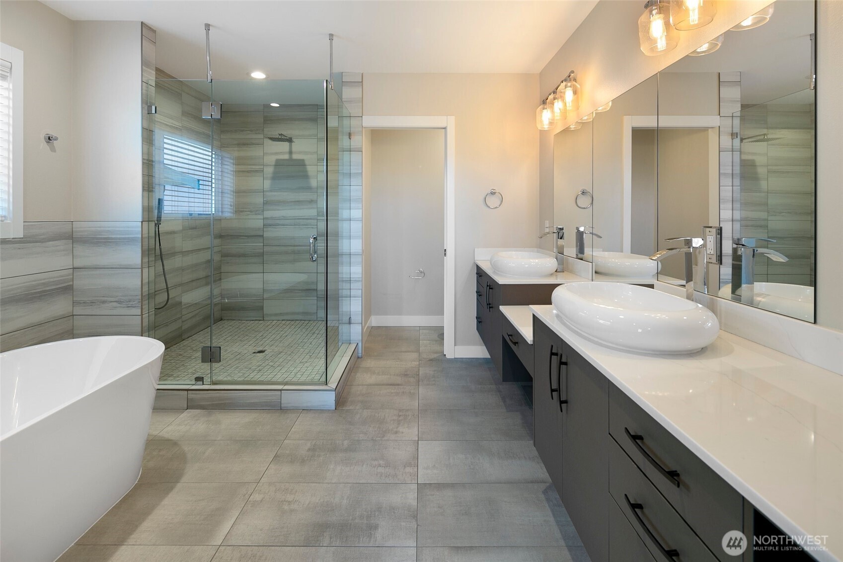 11838 79th Avenue South Seattle, WA 98178 - Photo 18 of 38 a bathroom with a double vanity sink mirror and shower