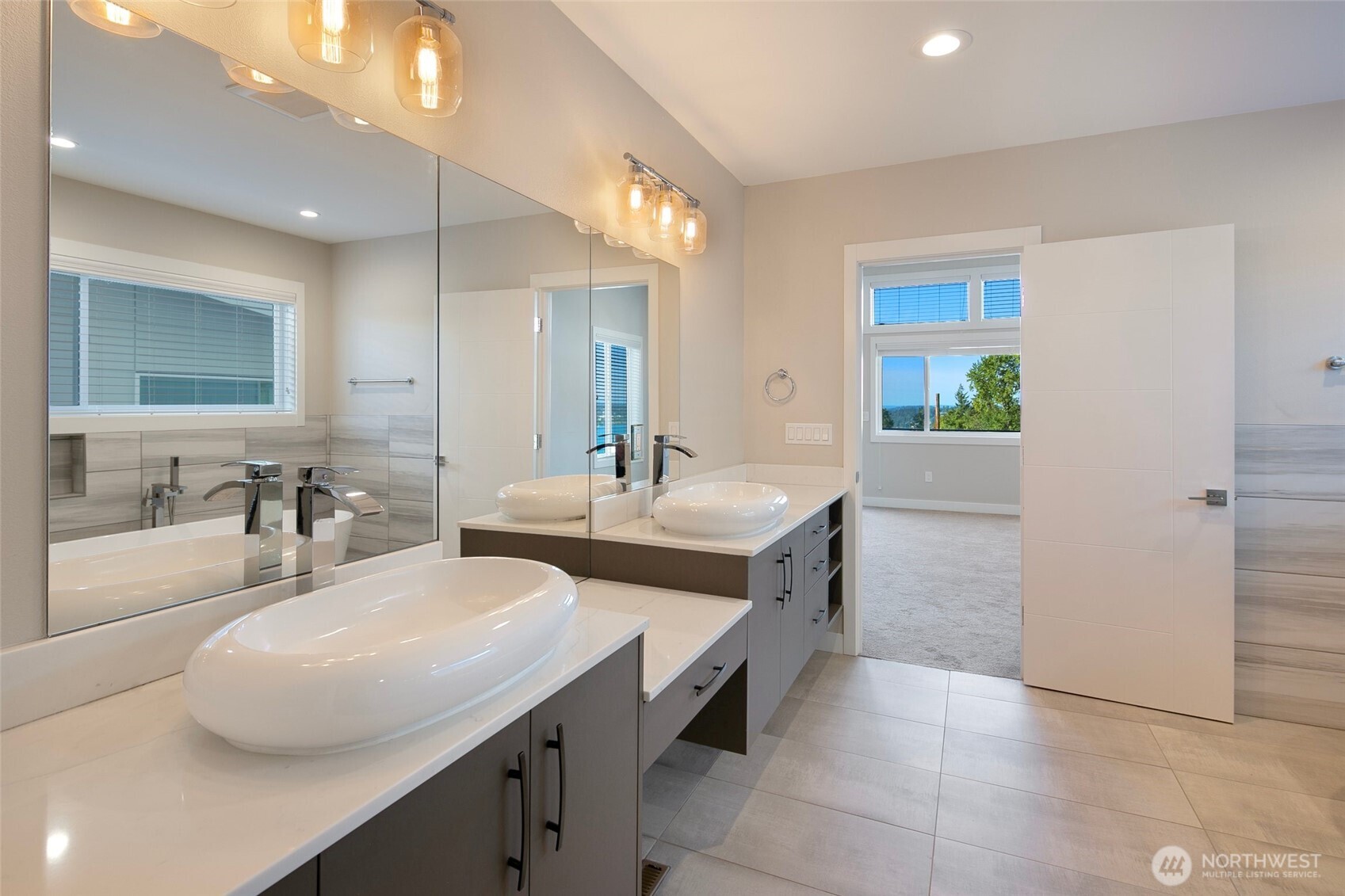 11838 79th Avenue South Seattle, WA 98178 - Photo 19 of 38 a bathroom with a double vanity sink and a mirror
