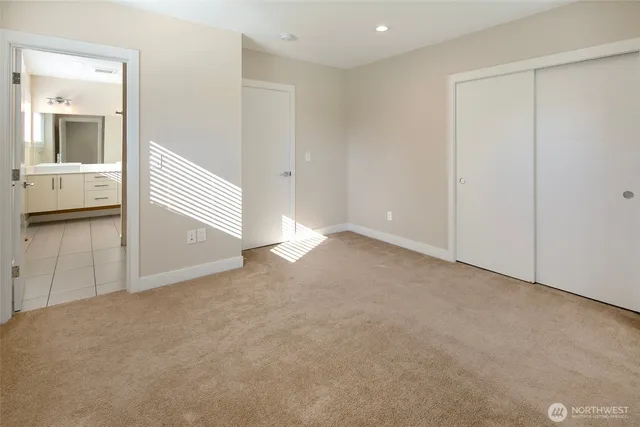 an empty room with a empty space and windows