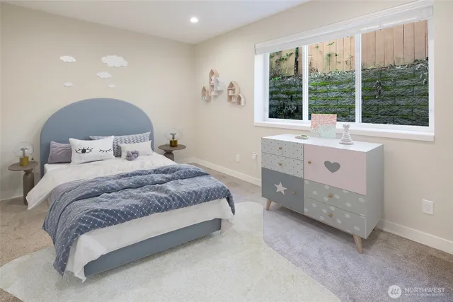 a spacious bedroom with a bed and a large window