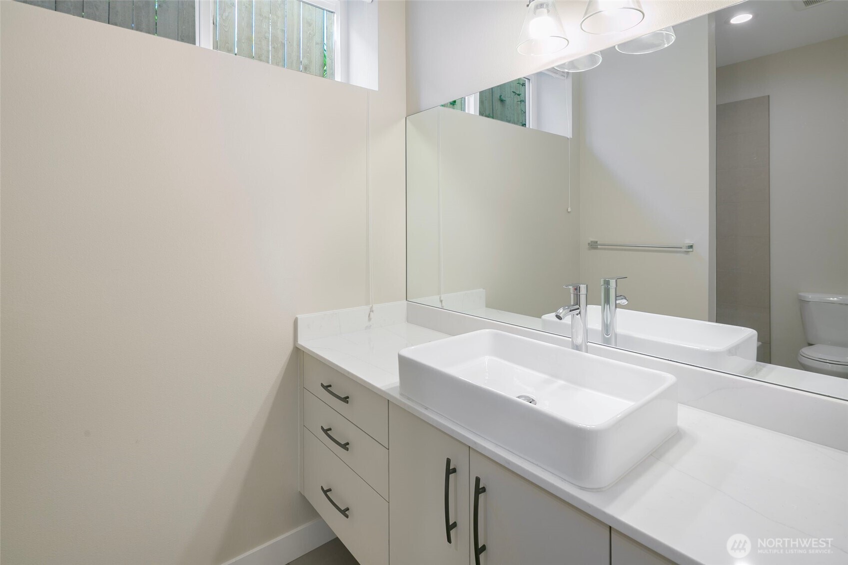 11838 79th Avenue South Seattle, WA 98178 - Photo 29 of 38 a bathroom with a sink and a mirror