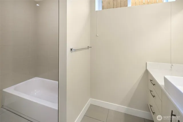 a bathroom with a sink and vanity