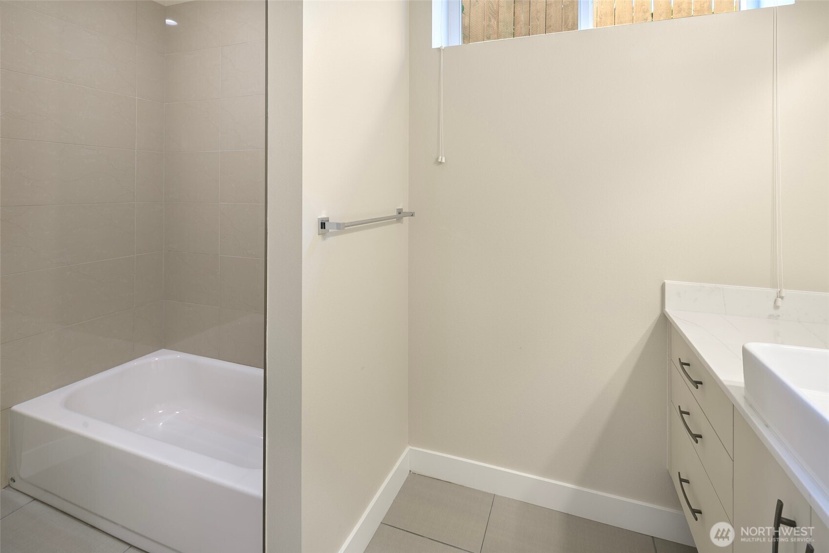 11838 79th Avenue South Seattle, WA 98178 - Photo 30 of 38 a bathroom with a sink and vanity