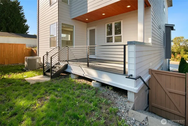 a view of a house with a yard and sitting area