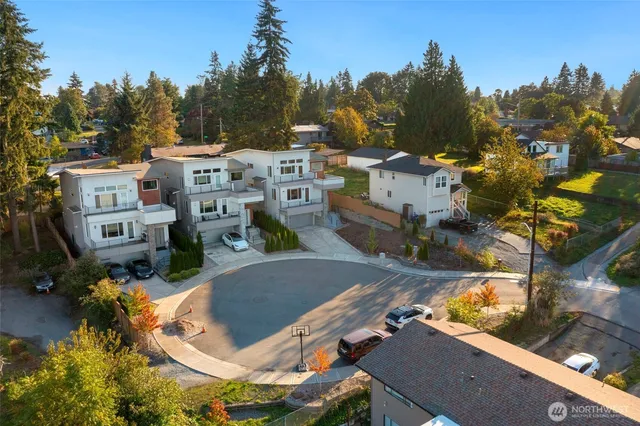 an aerial view of residential building with outdoor space and lake view