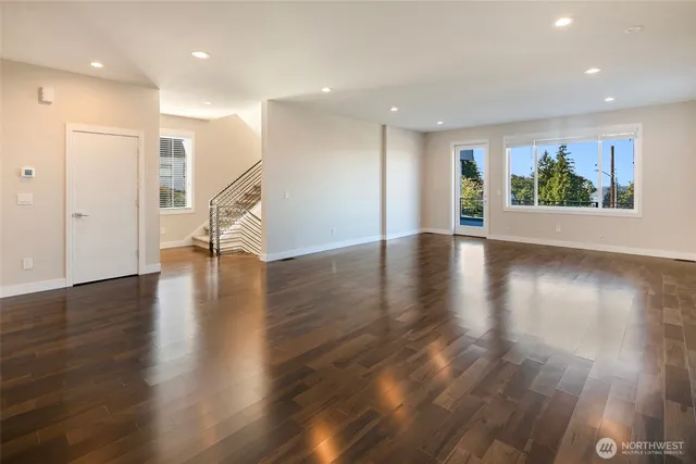 a view of an entryway with wooden floor