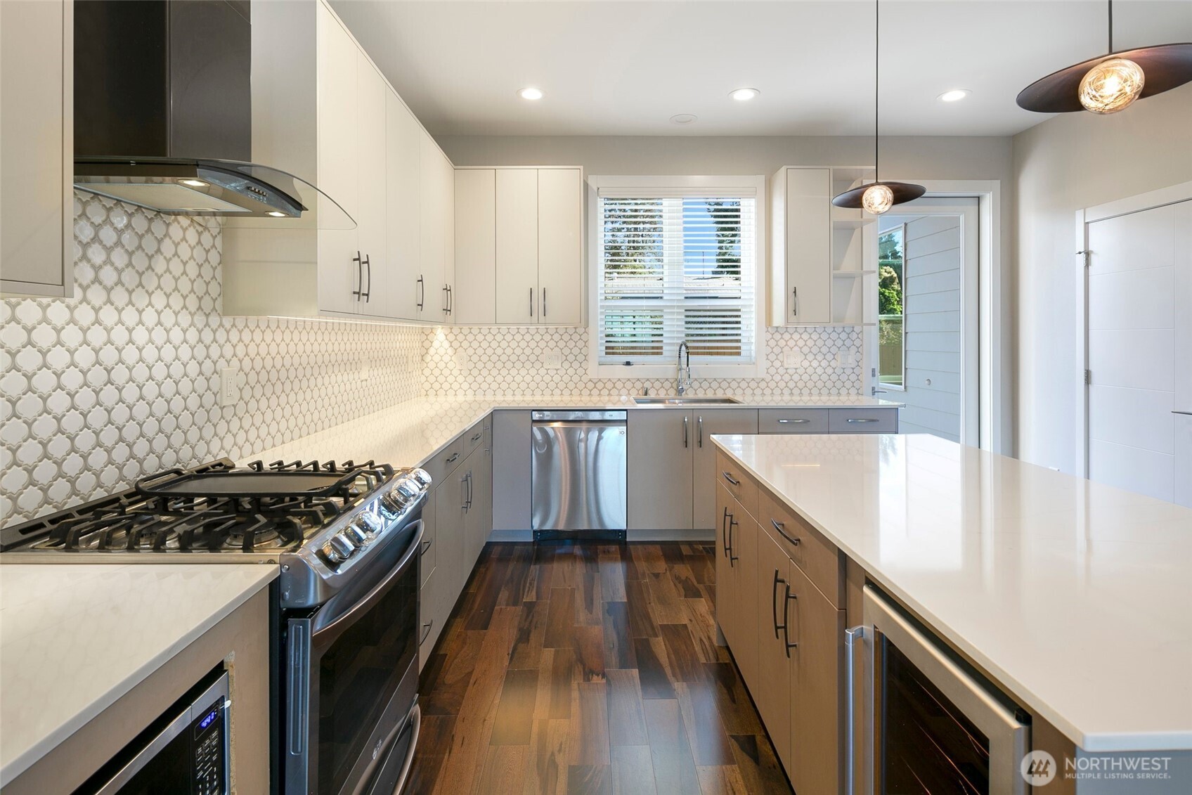 11838 79th Avenue South Seattle, WA 98178 - Photo 10 of 38 a kitchen with granite countertop a stove and a sink
