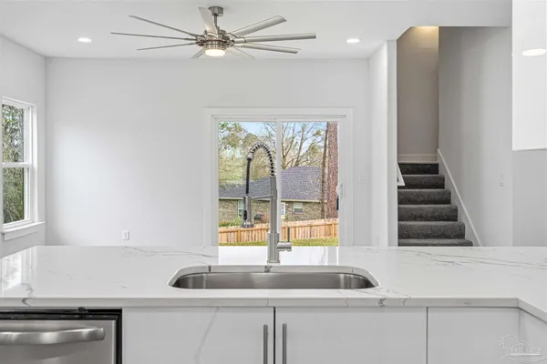 a kitchen with a sink and a window