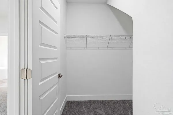 a view of storage and utility room with empty racks