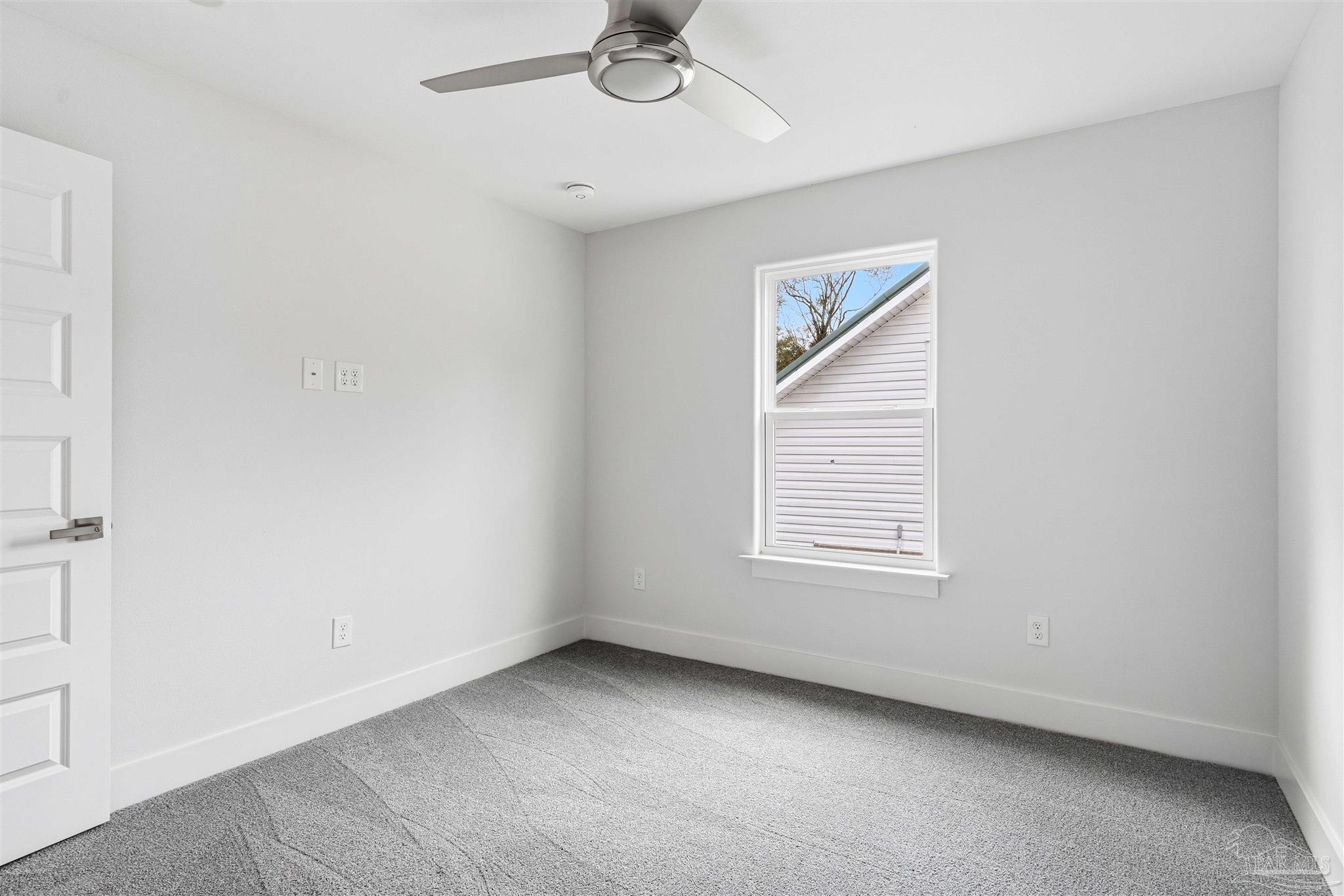 4446 Antioch Road Crestview, FL 32536 - Photo 26 of 43 a view of an empty room with a window