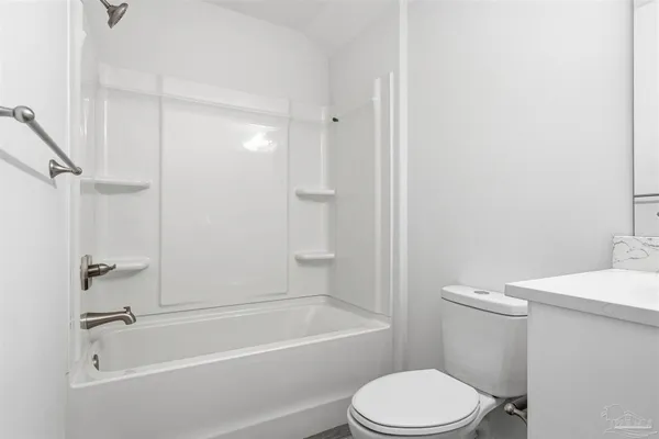 a bathroom with a sink a toilet and a bathtub