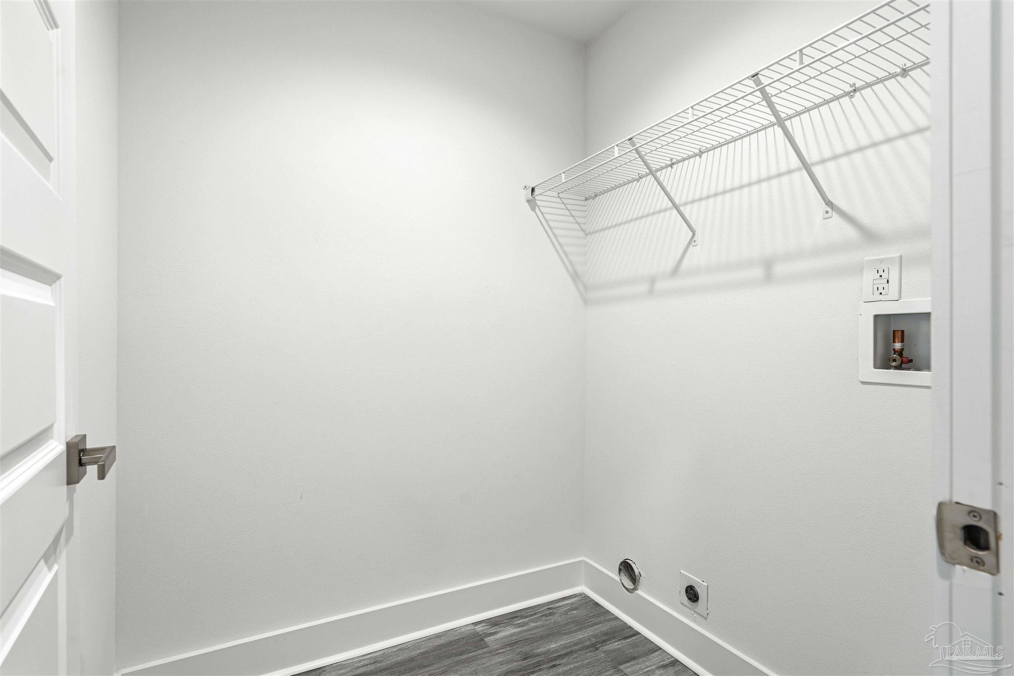 4446 Antioch Road Crestview, FL 32536 - Photo 31 of 43 a view of a room with racks on the wall