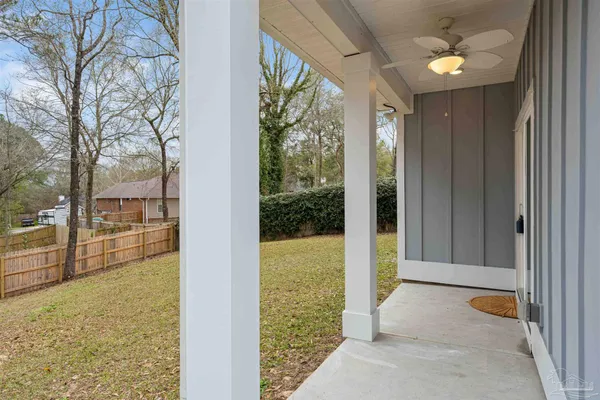a view of backyard with large trees