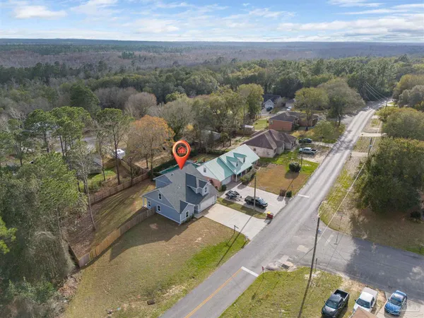 an aerial view of a house with a garden