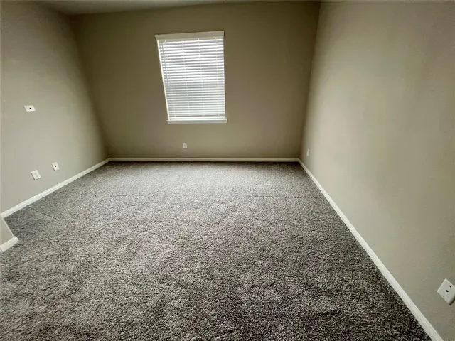 an empty room with a empty space and window