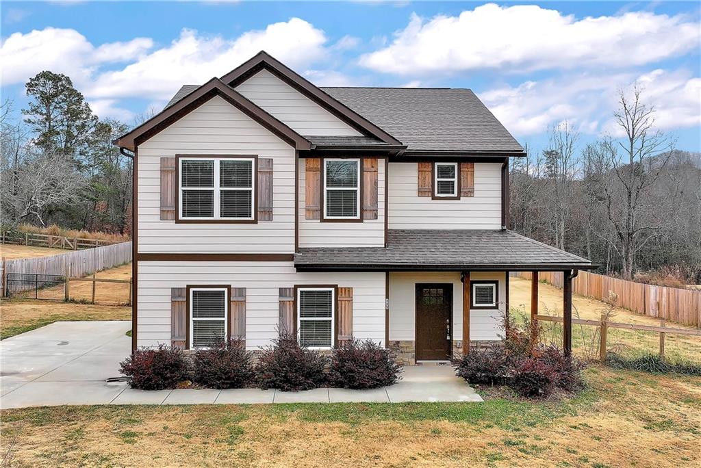 489 Asbury Mill Road Cleveland, GA 30528 - Photo 1 of 34 a front view of a house with yard