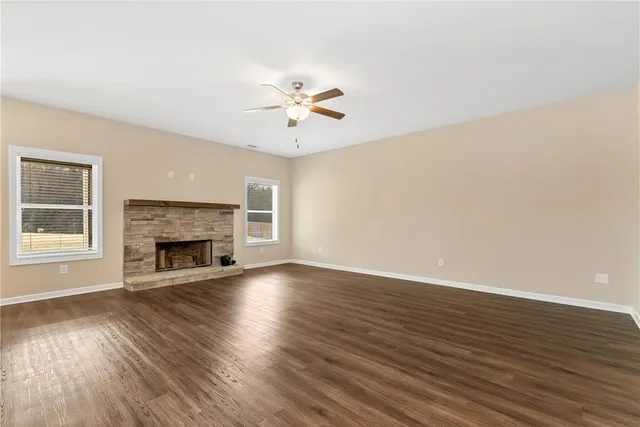 a kitchen with stainless steel appliances granite countertop a stove a refrigerator and a microwave