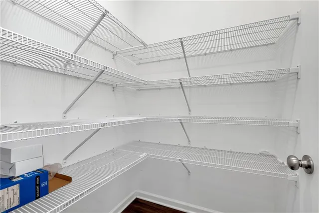 a view of hallway with wooden floor
