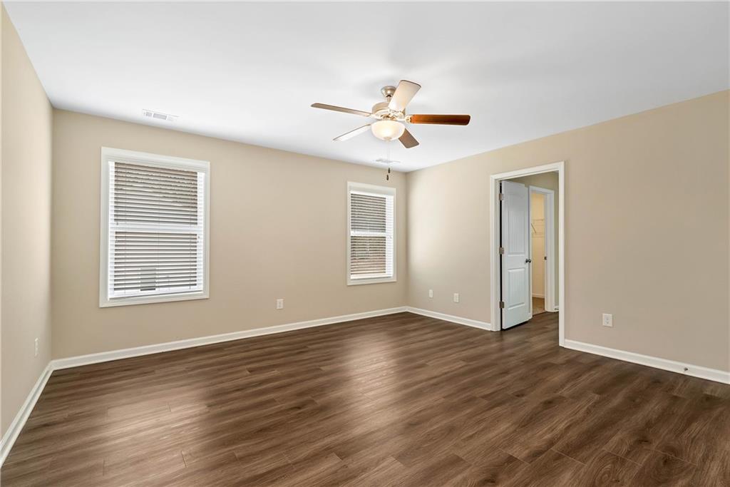 489 Asbury Mill Road Cleveland, GA 30528 - Photo 32 of 34 a view of an empty room with wooden floor and a window
