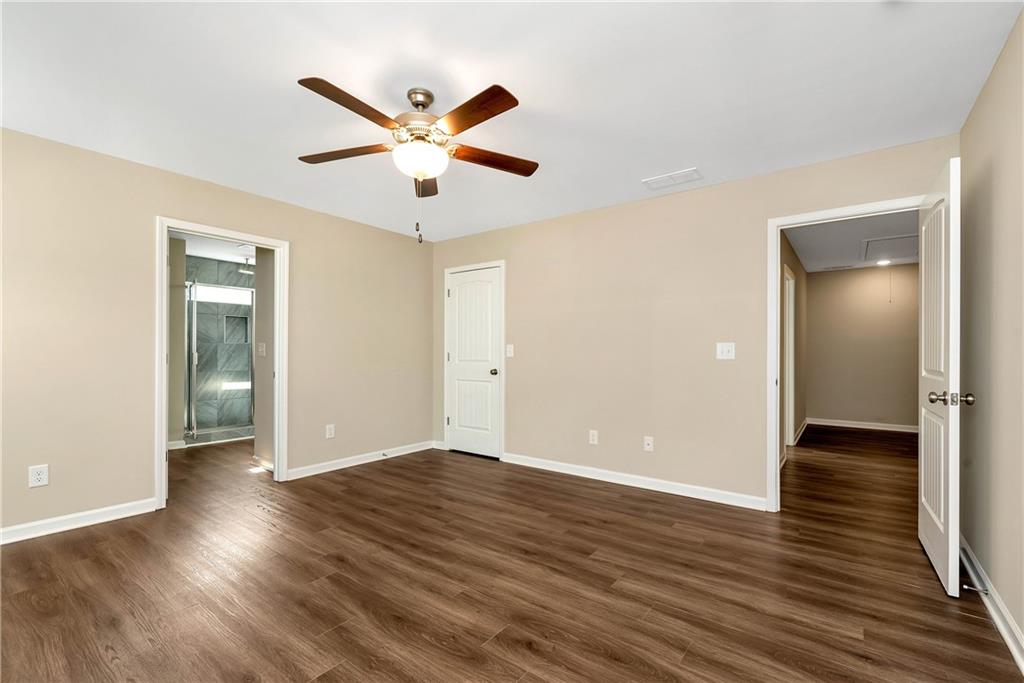 489 Asbury Mill Road Cleveland, GA 30528 - Photo 33 of 34 wooden floor in an empty room with a window