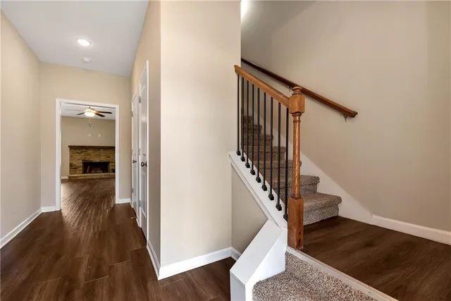 a view of entryway and hall with wooden floor