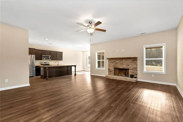 a view of a kitchen with a stove cabinets and a fireplace