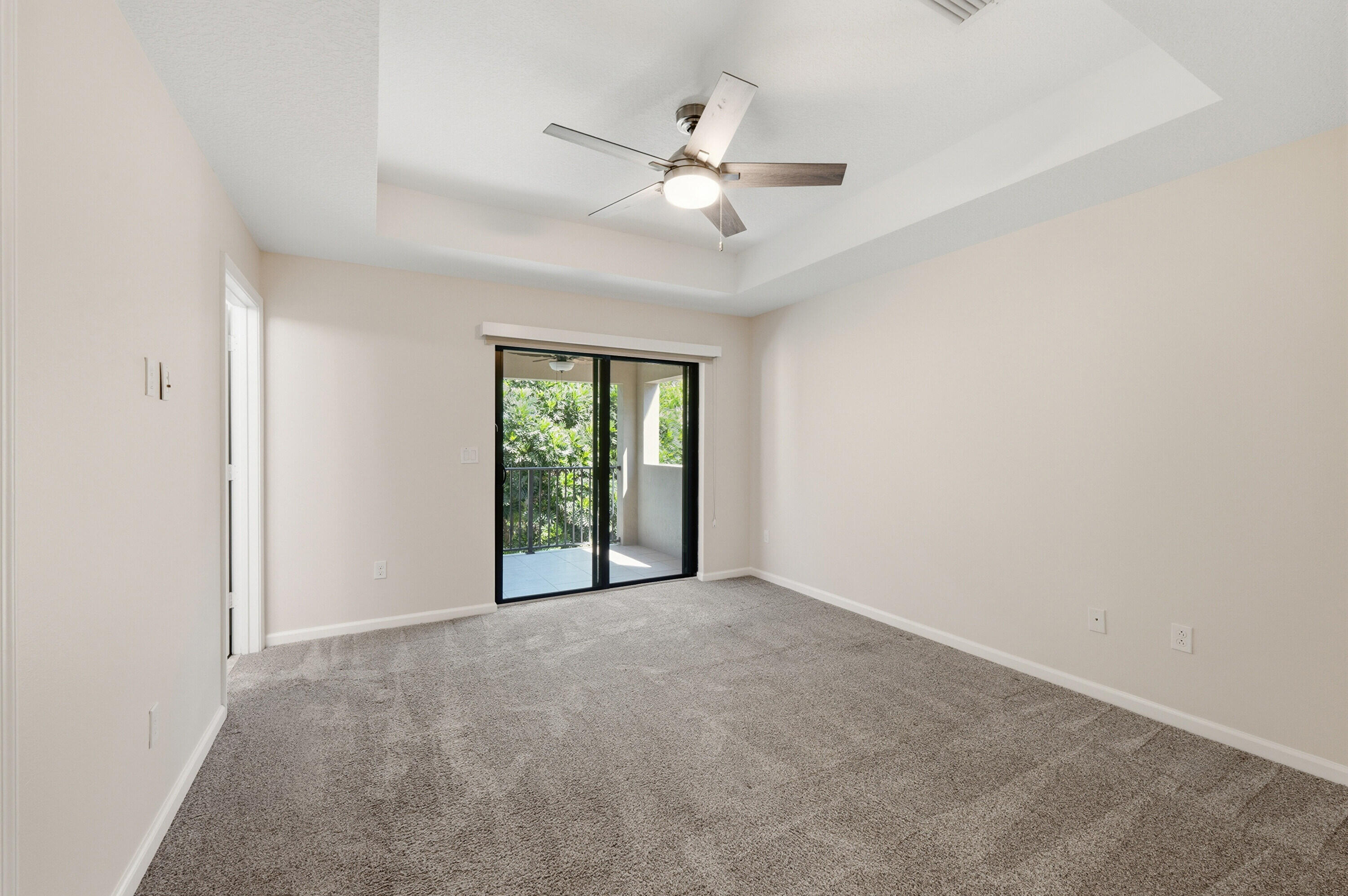 340 Northwest 33rd Lane Pompano Beach, FL 33069 - Photo 17 of 47 an empty room with fan and windows