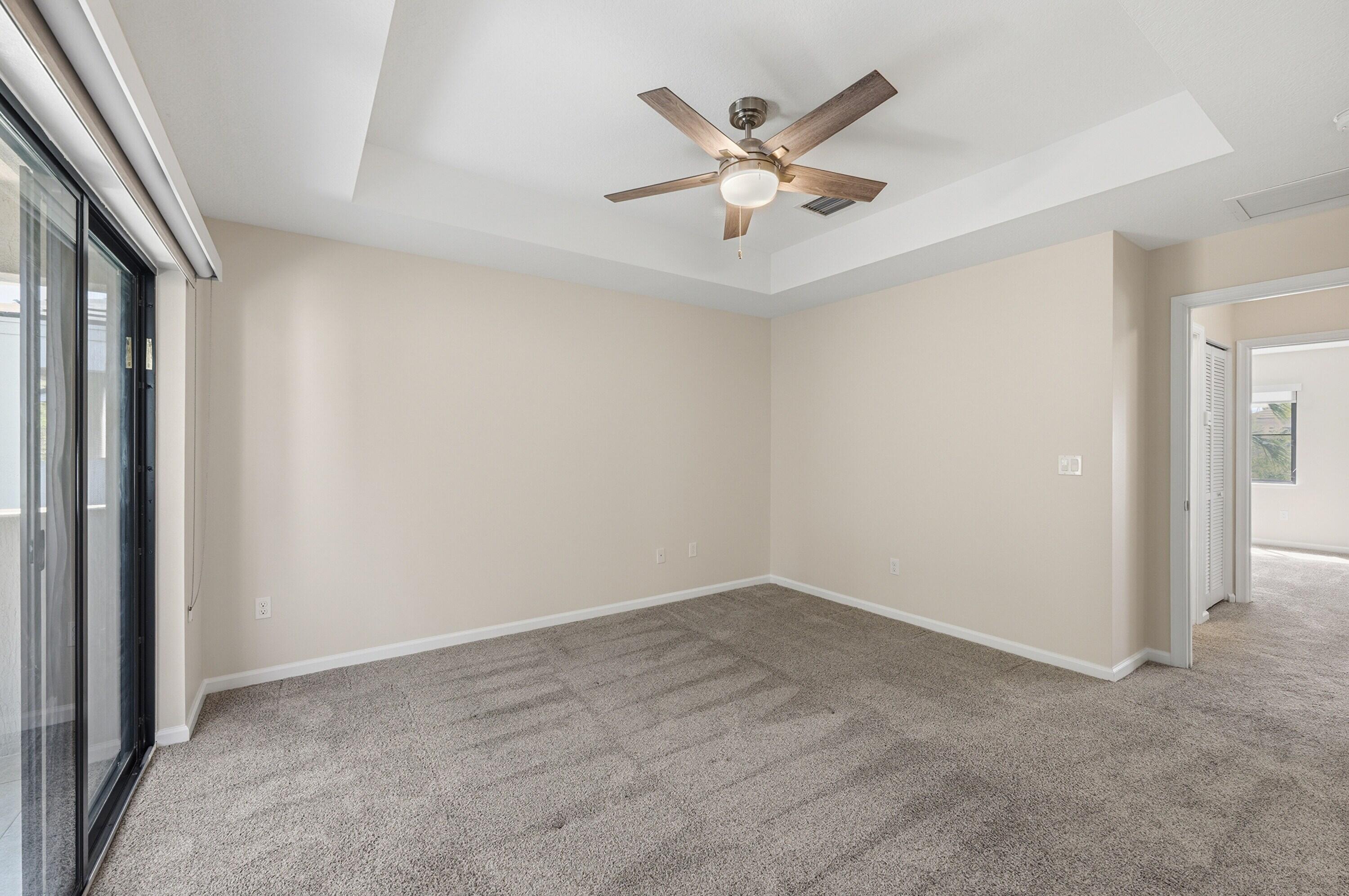 340 Northwest 33rd Lane Pompano Beach, FL 33069 - Photo 21 of 47 an empty room with closet and fan