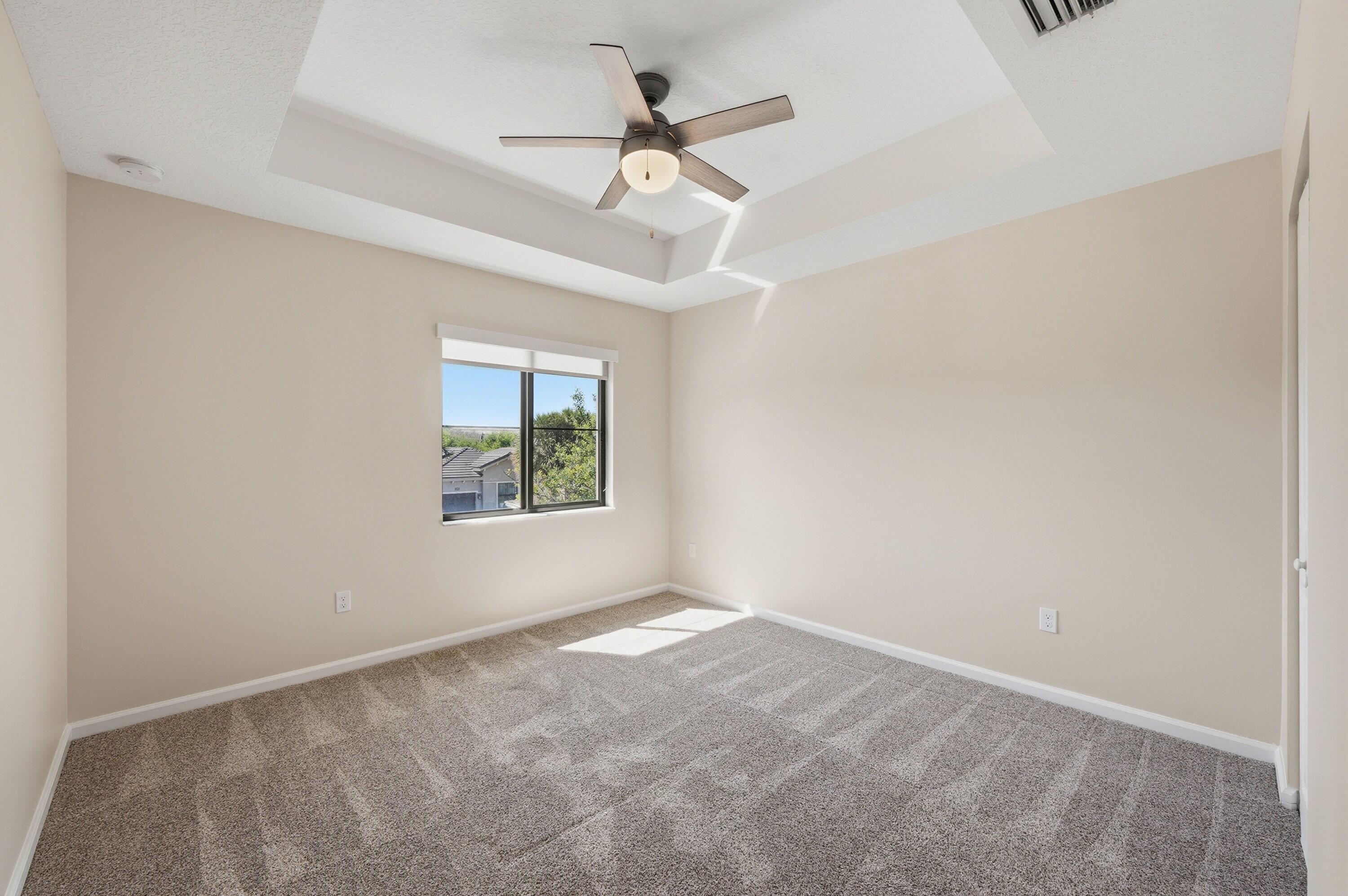 340 Northwest 33rd Lane Pompano Beach, FL 33069 - Photo 25 of 47 an empty room with a window and a fan