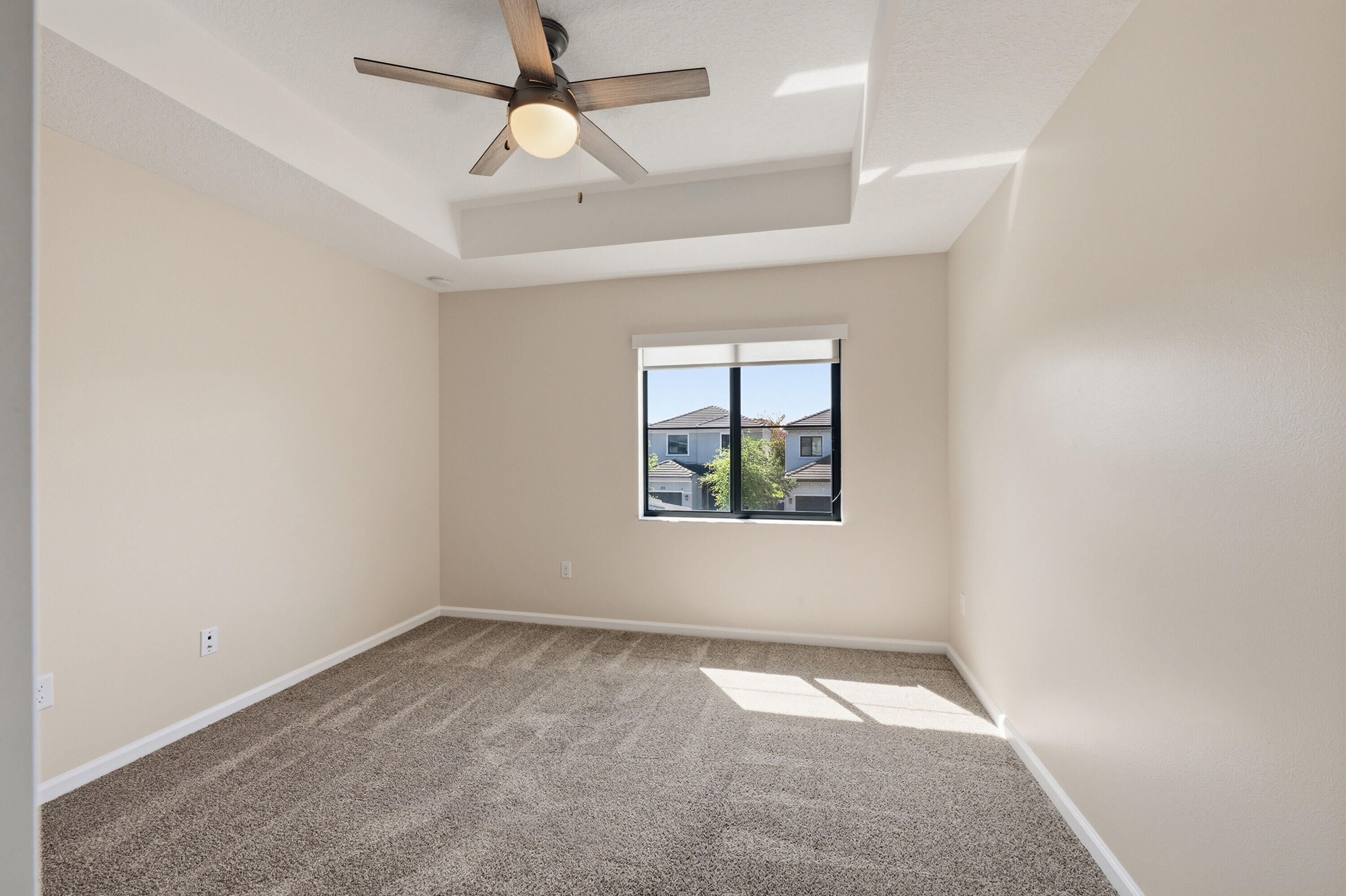 340 Northwest 33rd Lane Pompano Beach, FL 33069 - Photo 26 of 47 an empty room with ceiling fan and window