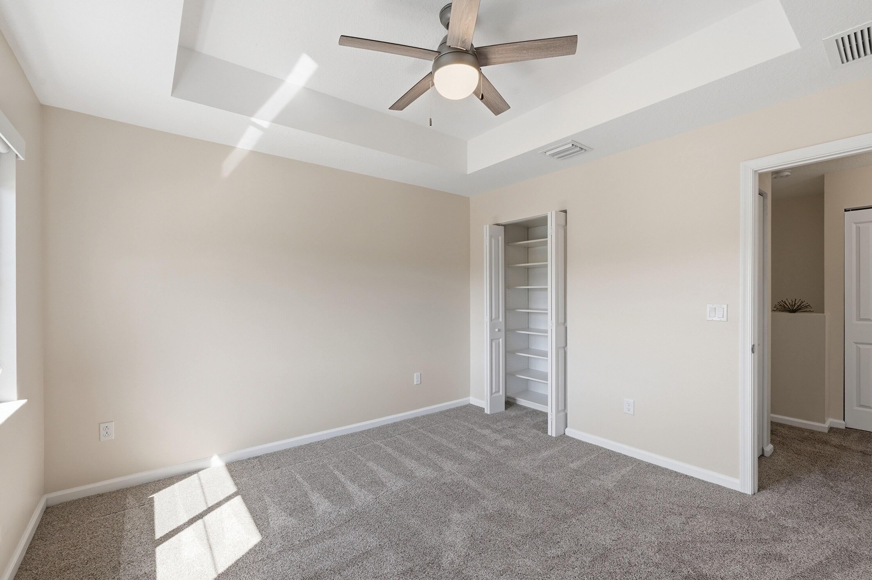 340 Northwest 33rd Lane Pompano Beach, FL 33069 - Photo 27 of 47 an empty room with closet and a chandelier fan
