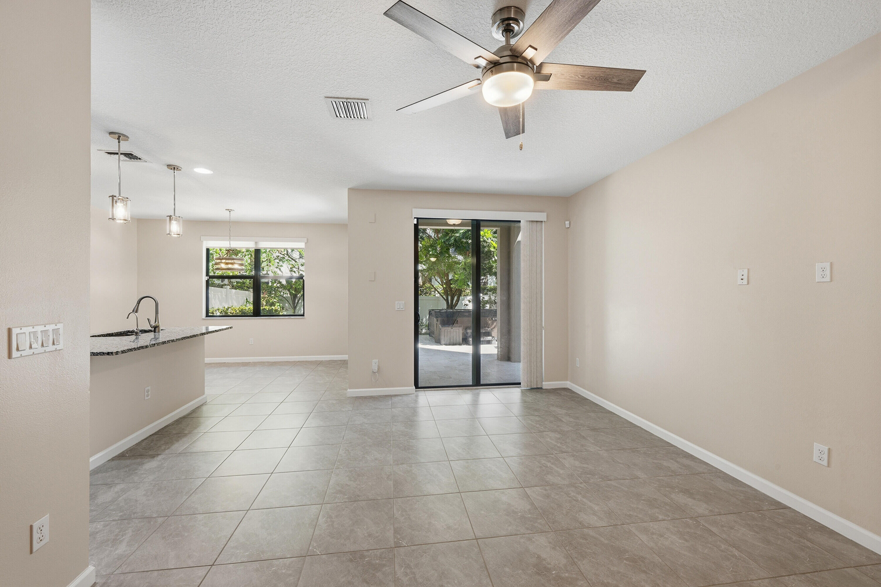 340 Northwest 33rd Lane Pompano Beach, FL 33069 - Photo 3 of 47 a view of an empty room with a window