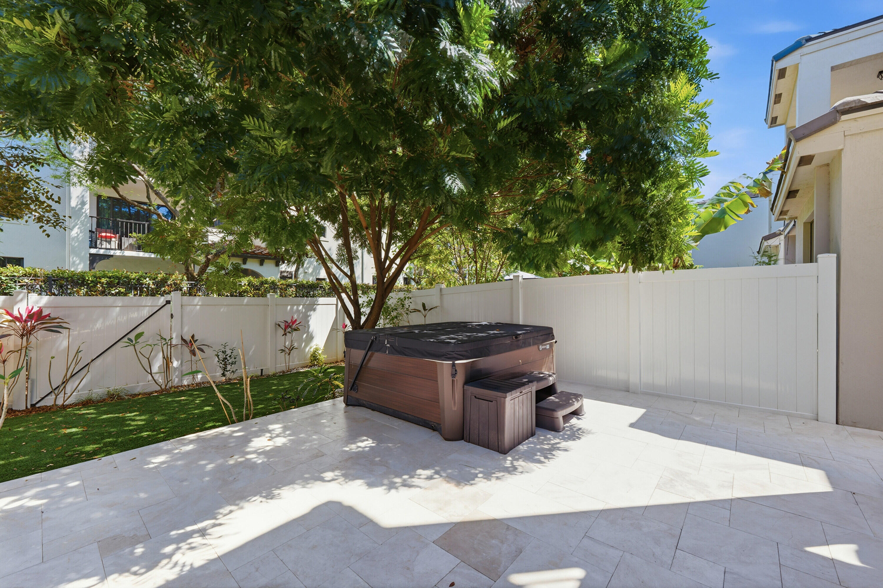 340 Northwest 33rd Lane Pompano Beach, FL 33069 - Photo 35 of 47 a wooden bench sitting in a backyard