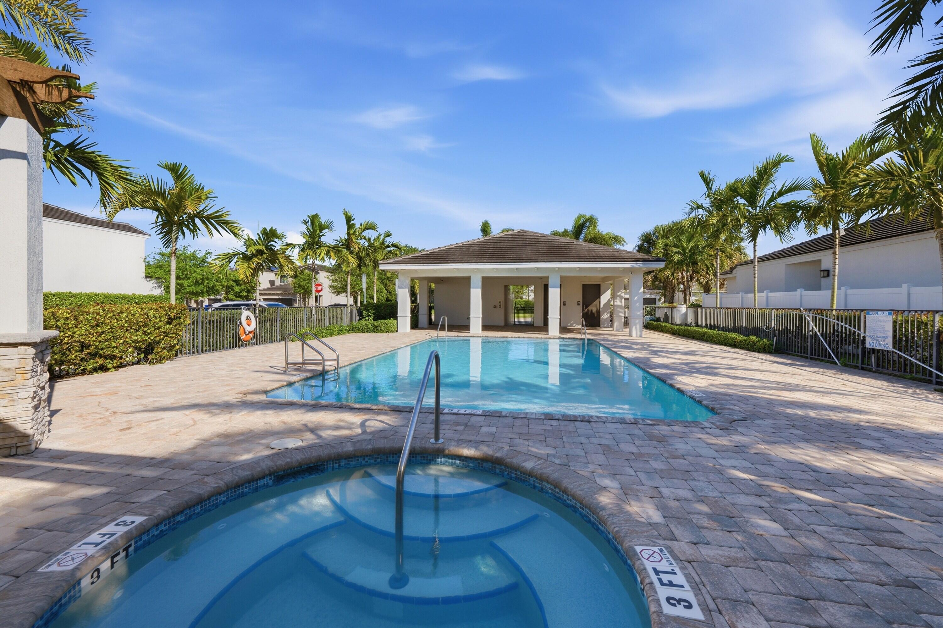 340 Northwest 33rd Lane Pompano Beach, FL 33069 - Photo 43 of 47 a front view of a house with a yard
