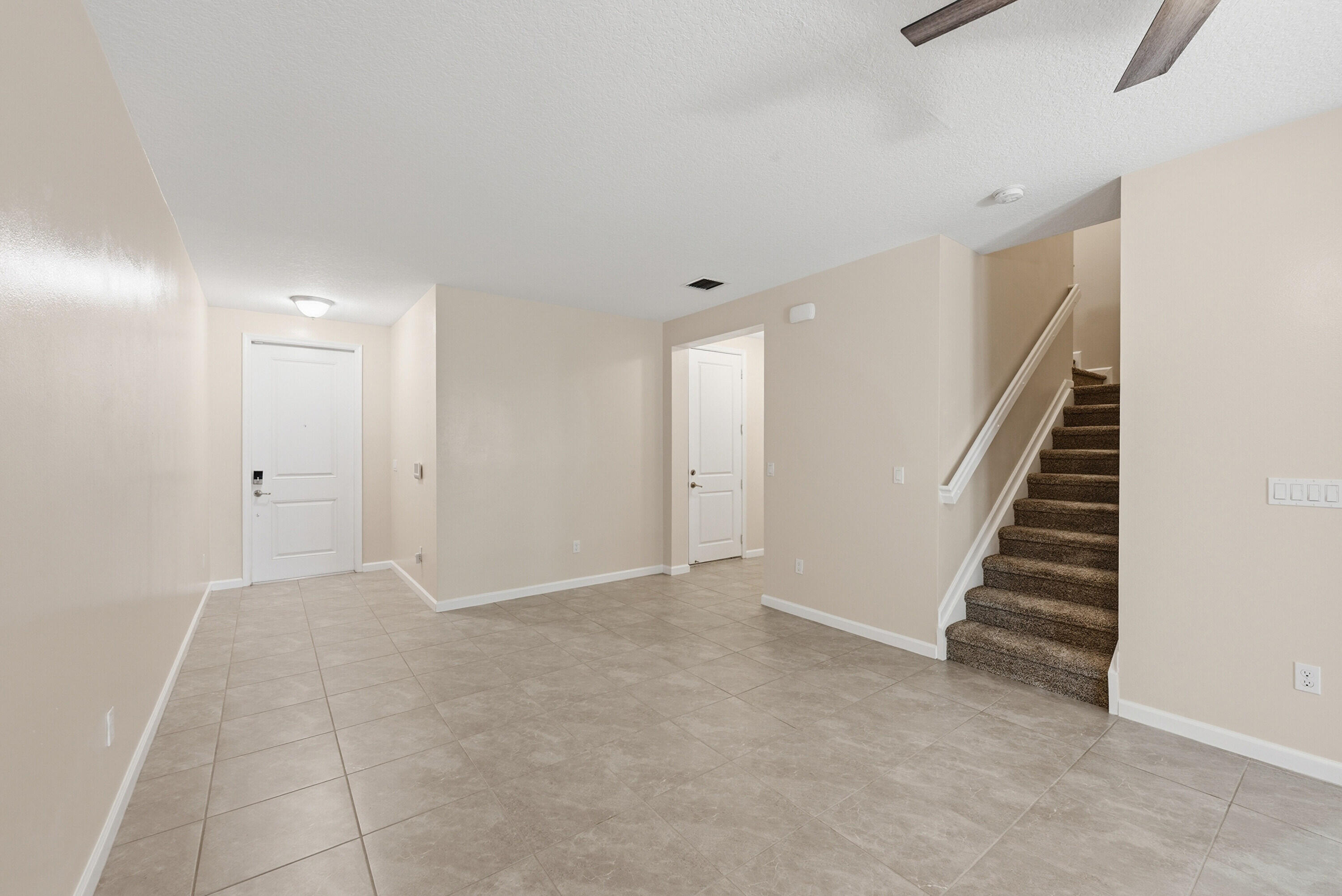340 Northwest 33rd Lane Pompano Beach, FL 33069 - Photo 7 of 47 a view of an empty room with stairs