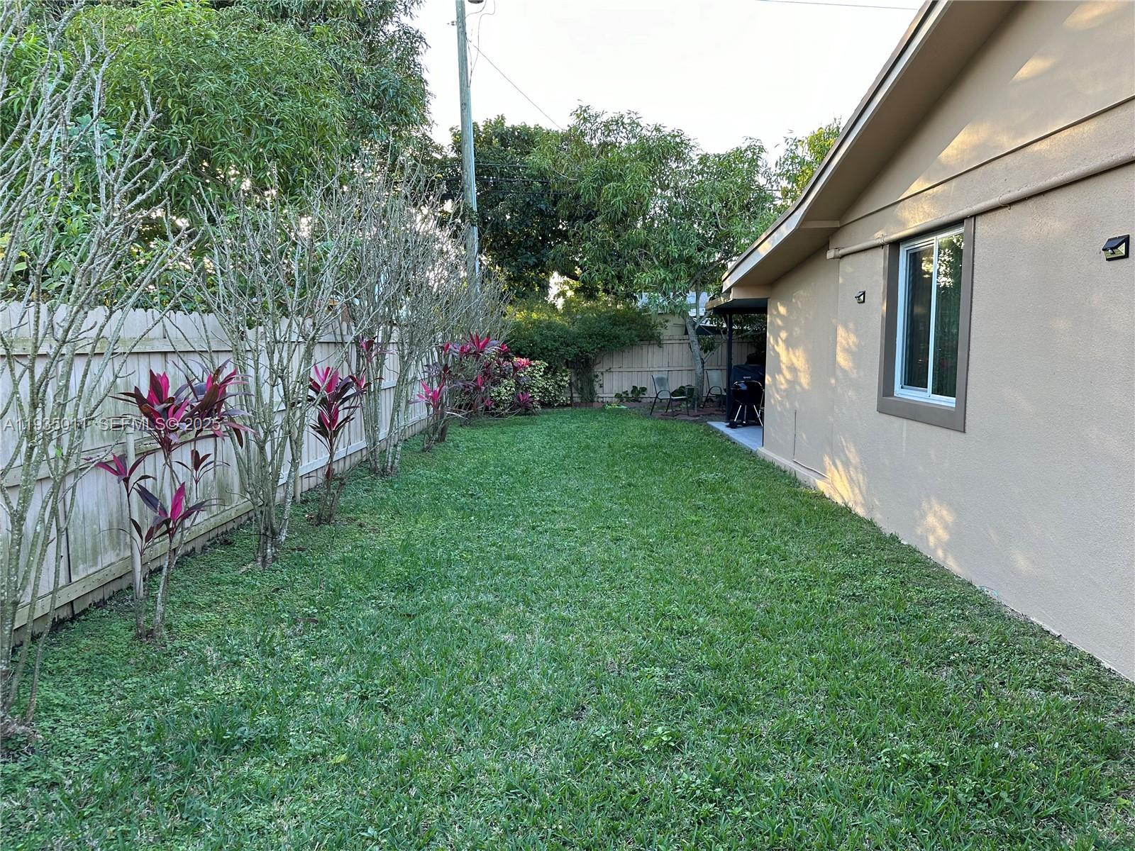 19360 Southwest 116th Avenue Miami, FL 33157 - Photo 13 of 17 a view of back yard of the house