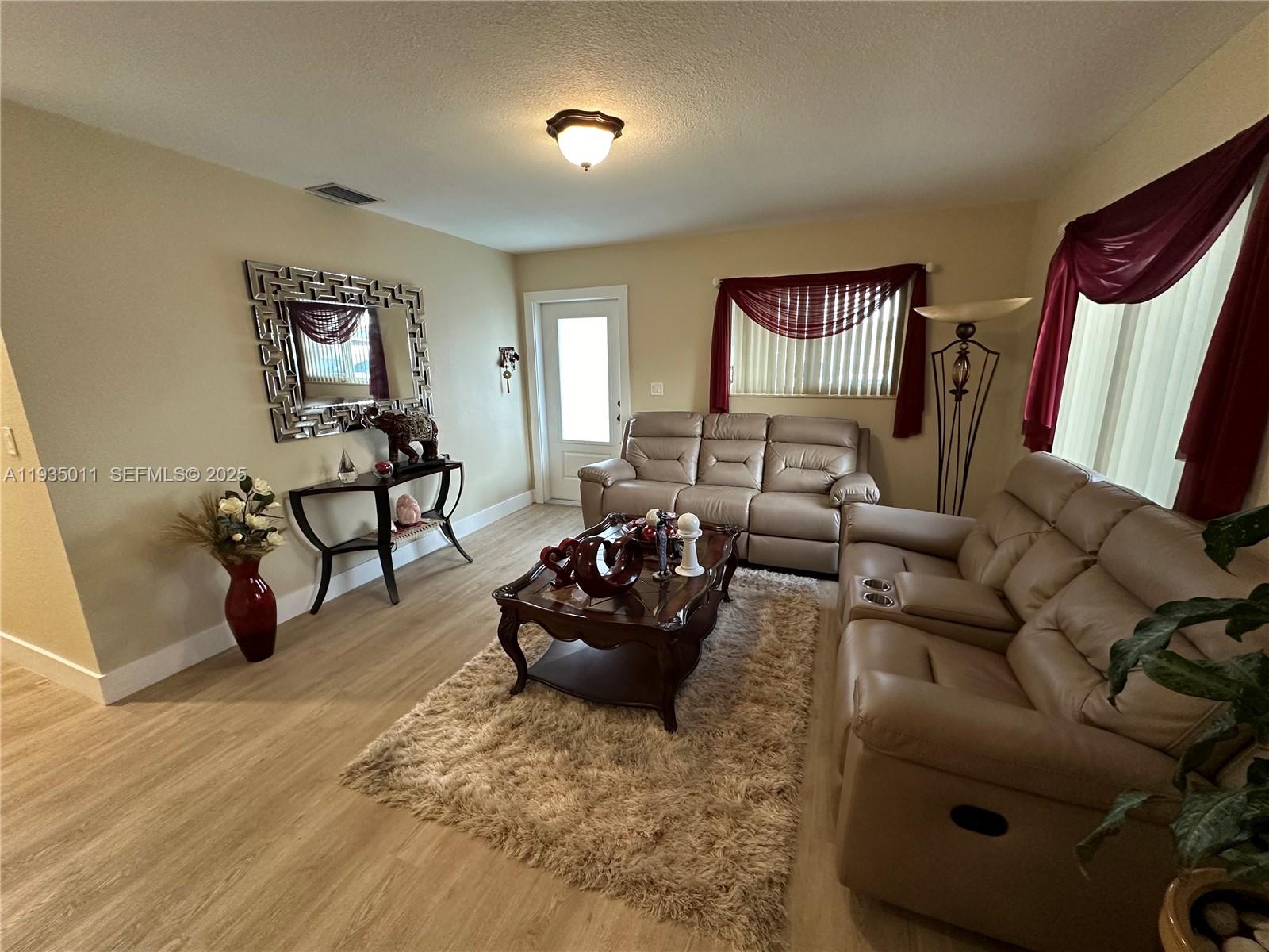 19360 Southwest 116th Avenue Miami, FL 33157 - Photo 15 of 17 a living room with furniture