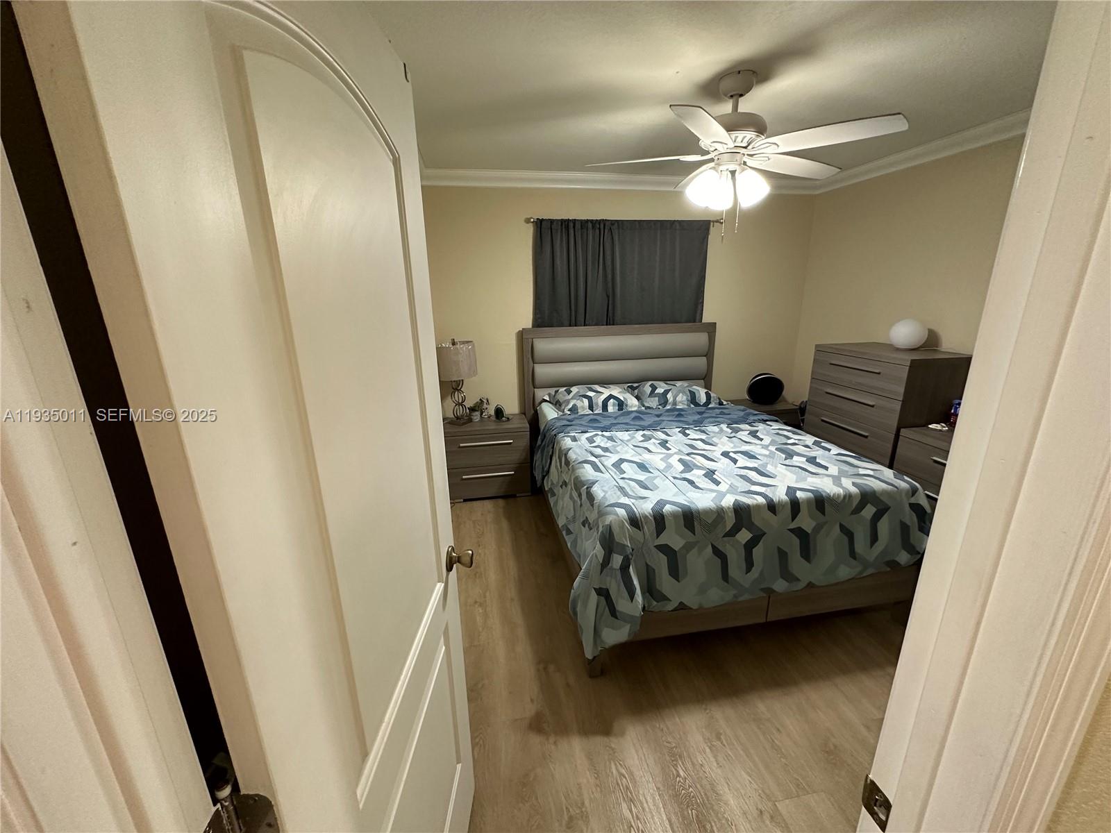 19360 Southwest 116th Avenue Miami, FL 33157 - Photo 2 of 17 a bedroom with a bed and a mirror