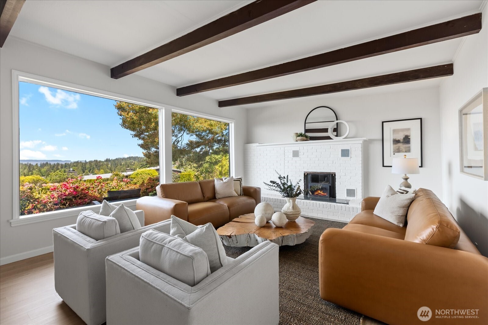 18220 Ridgefield Road Northwest Shoreline, WA 98177 - Photo 13 of 40 a living room with furniture fireplace and floor to ceiling windows