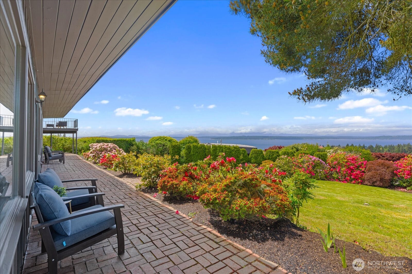 18220 Ridgefield Road Northwest Shoreline, WA 98177 - Photo 15 of 40 a view of a chairs and table on the balcony