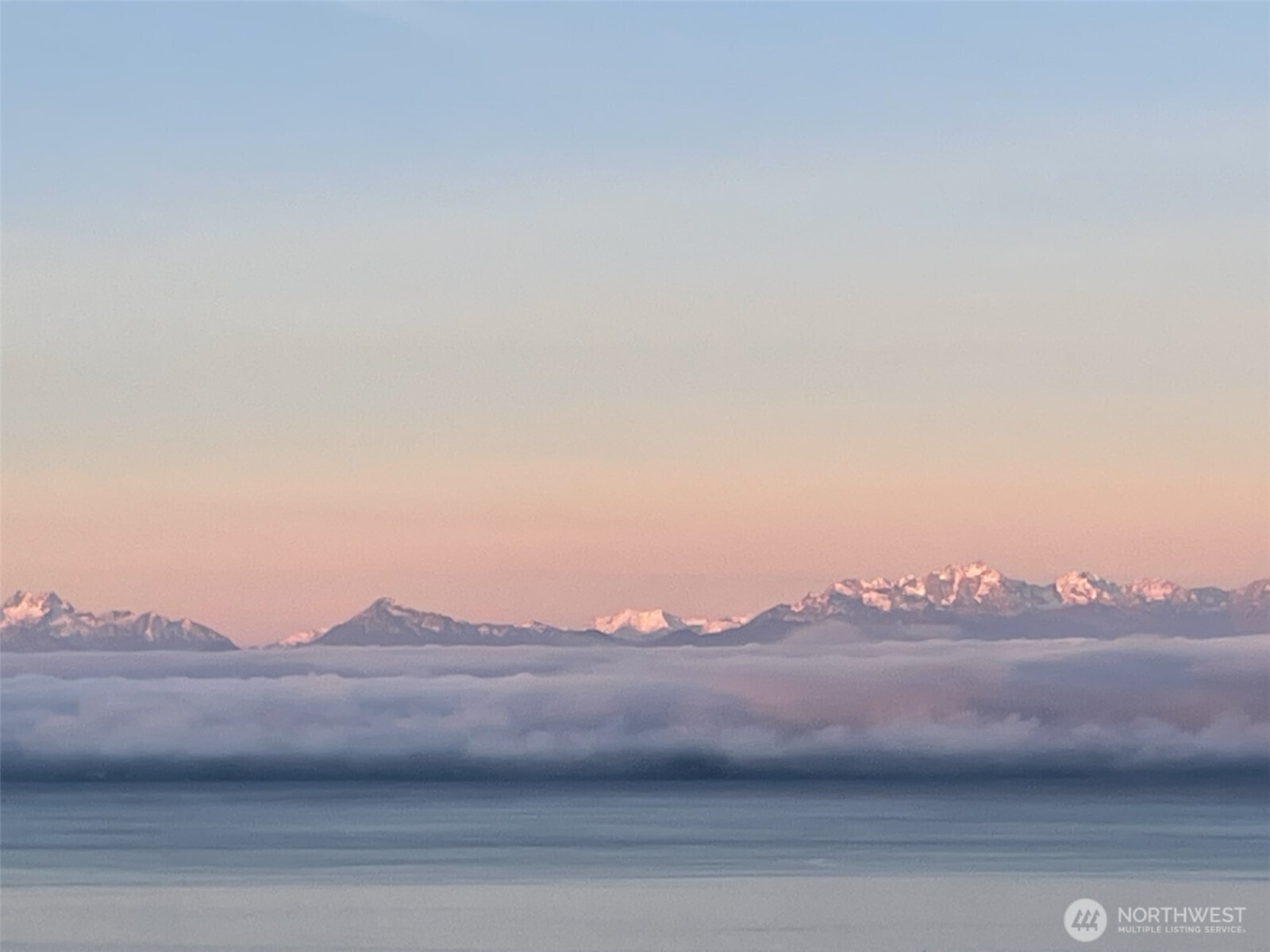 18220 Ridgefield Road Northwest Shoreline, WA 98177 - Photo 16 of 40 a view of houses with a mountain
