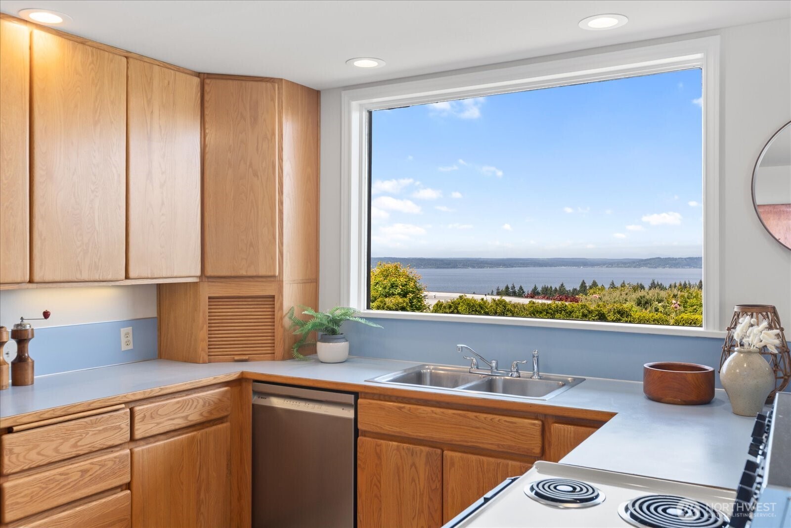 18220 Ridgefield Road Northwest Shoreline, WA 98177 - Photo 17 of 40 a view of a kitchen with a sink and large window