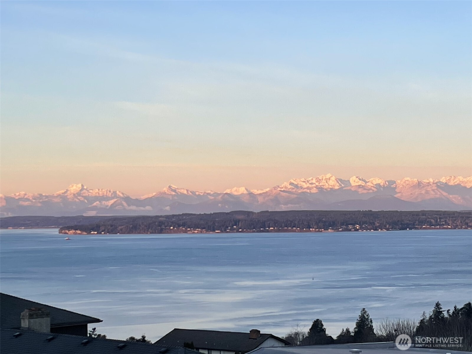 18220 Ridgefield Road Northwest Shoreline, WA 98177 - Photo 2 of 40 a view of a lake and a mountain