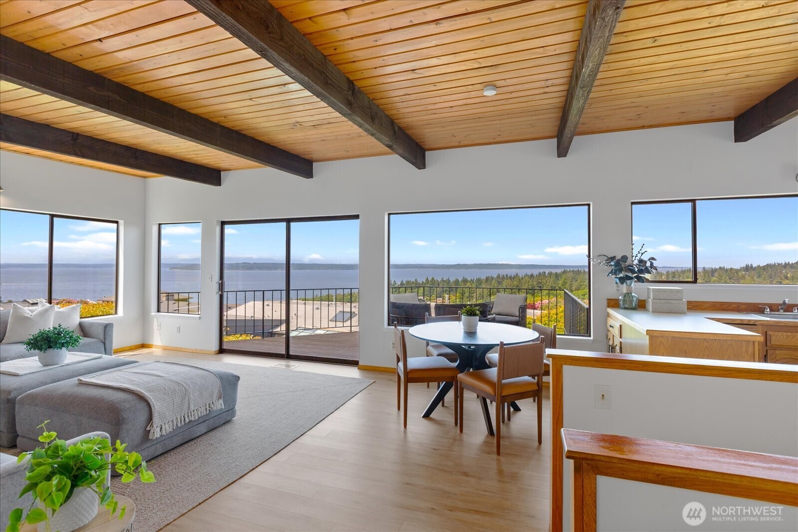 18220 Ridgefield Road Northwest Shoreline, WA 98177 - Photo 23 of 40 a bedroom with a bed and large windows