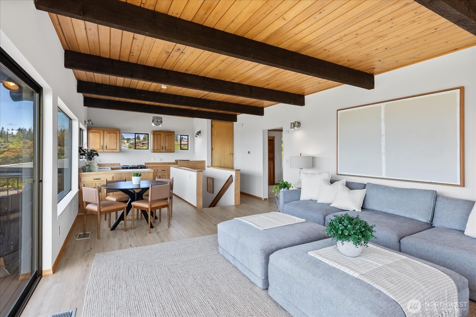18220 Ridgefield Road Northwest Shoreline, WA 98177 - Photo 25 of 40 a living room with furniture kitchen view and a large window