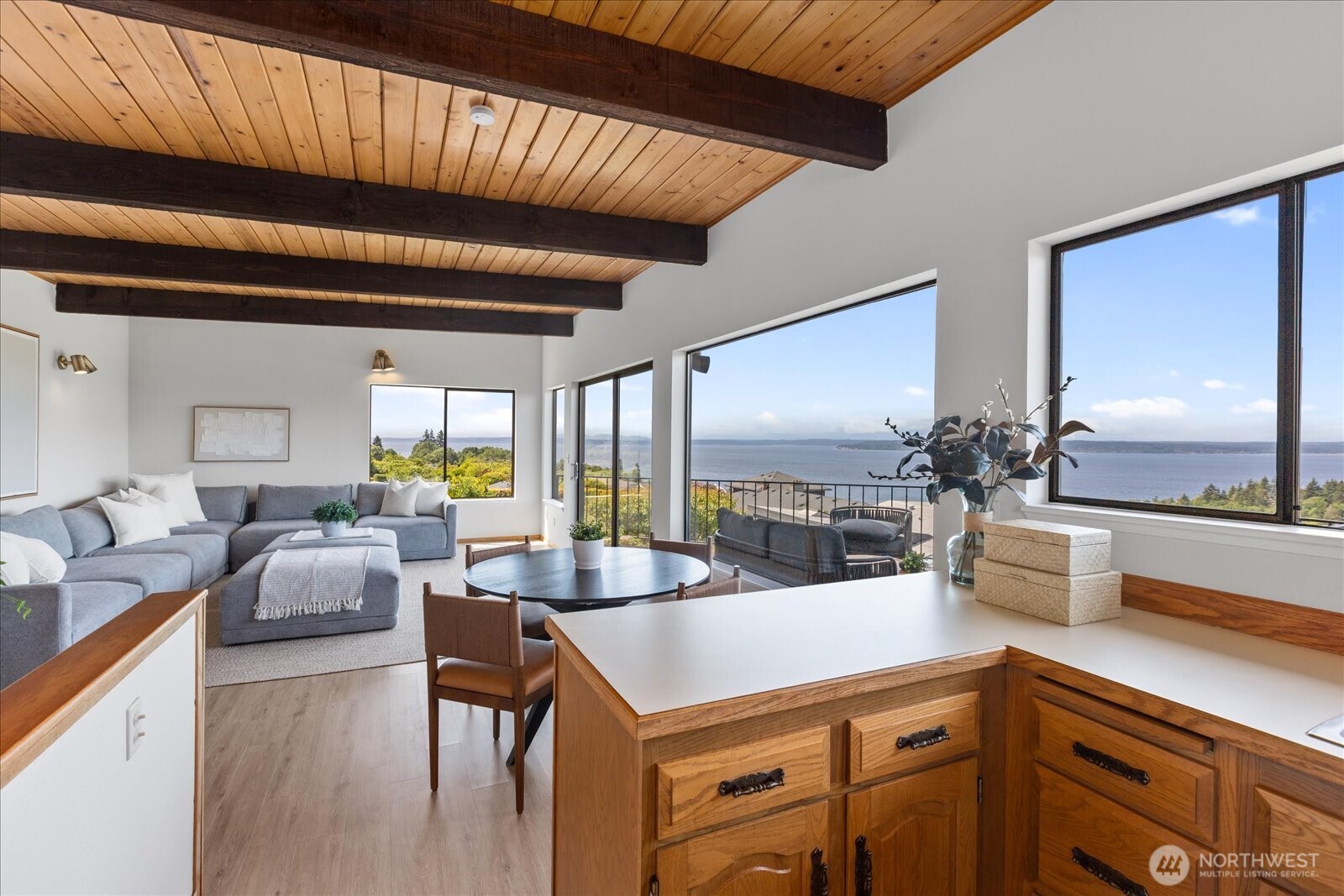18220 Ridgefield Road Northwest Shoreline, WA 98177 - Photo 26 of 40 a kitchen with a table chairs stove and kitchen view