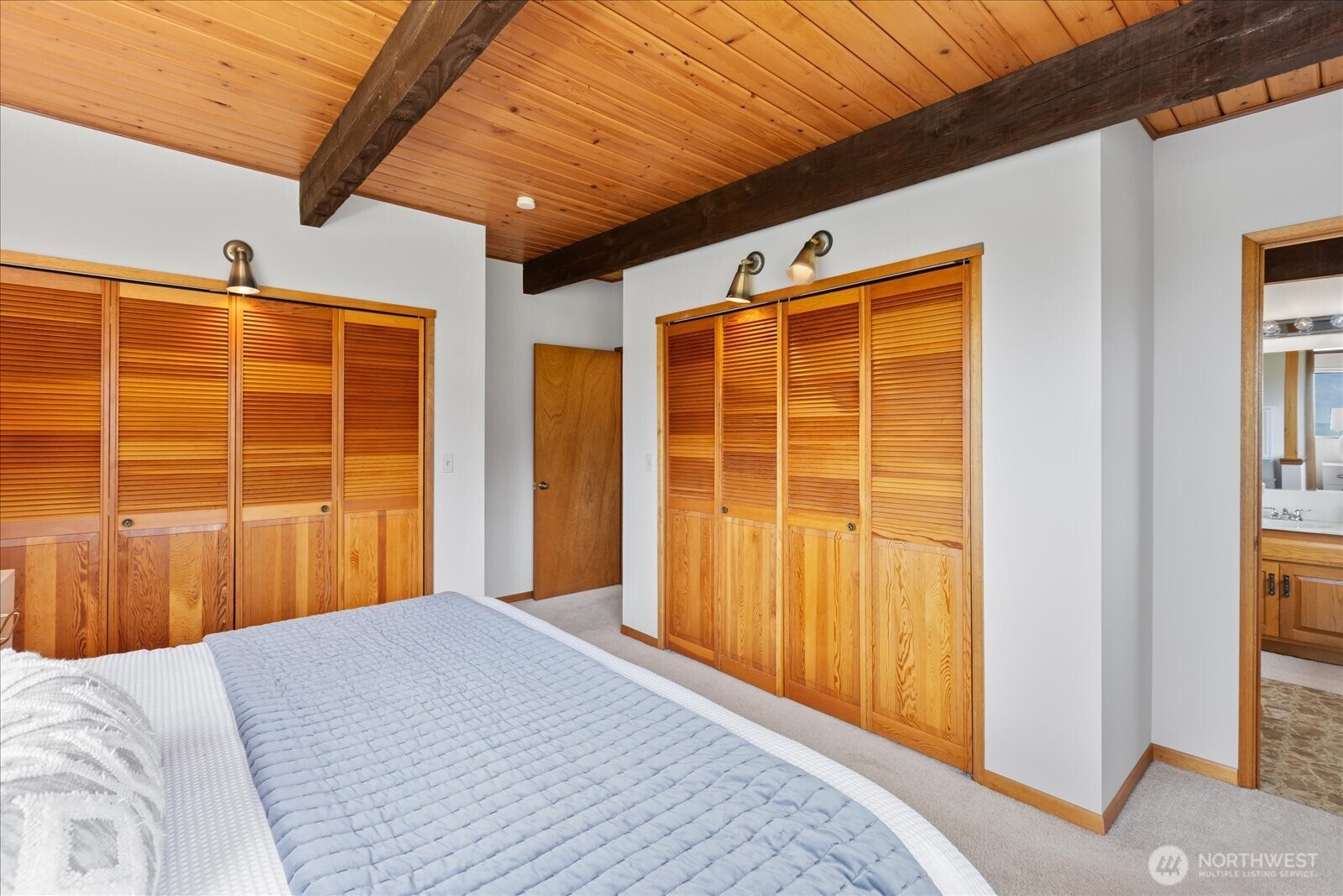 18220 Ridgefield Road Northwest Shoreline, WA 98177 - Photo 28 of 40 a bedroom with a bed and wooden floor