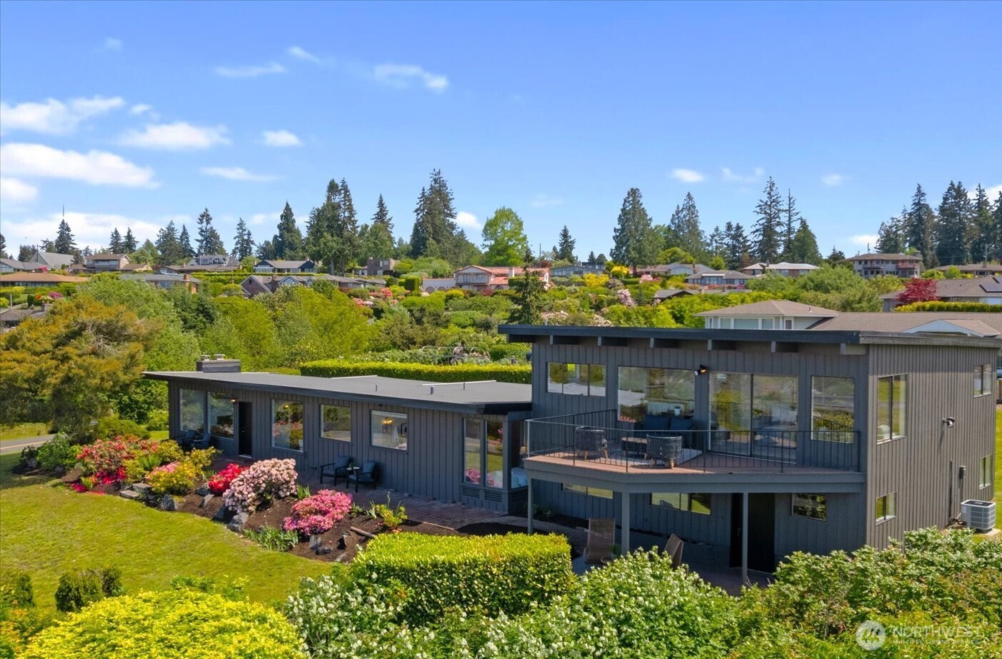 18220 Ridgefield Road Northwest Shoreline, WA 98177 - Photo 3 of 40 a view of a chairs and table in a patio with a yard
